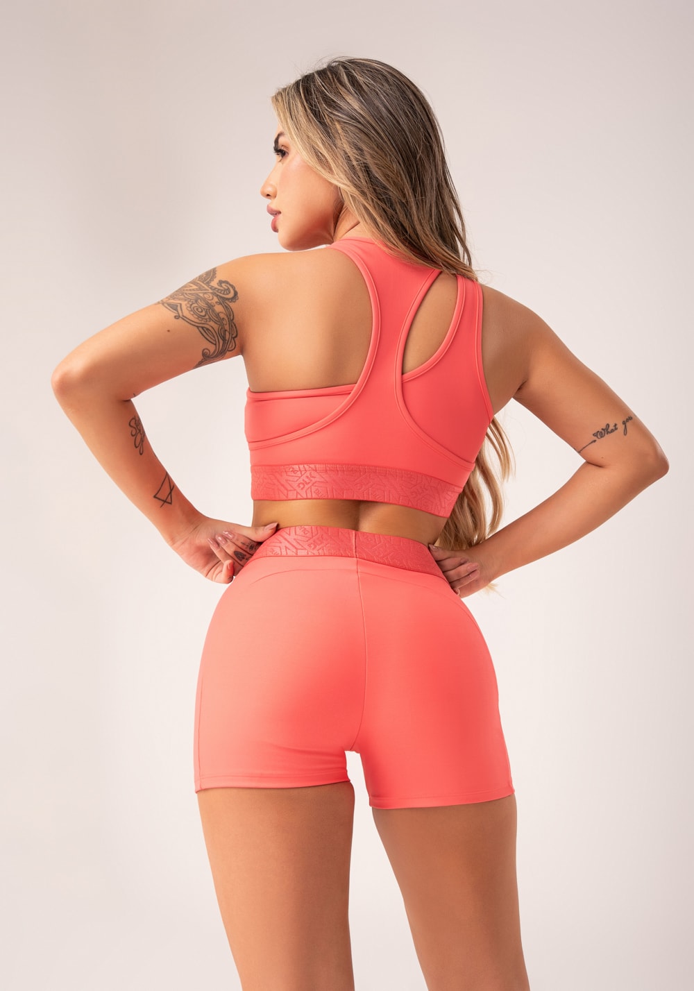 Top fitness feminino coral assimétrico com elástico flow