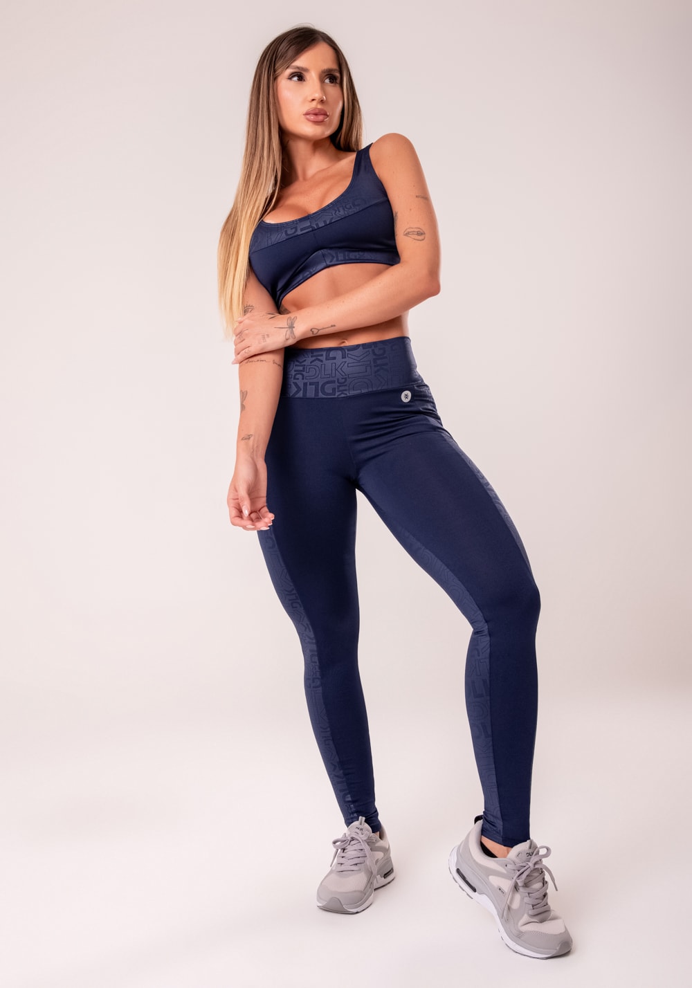 Legging fitness feminina azul marinho com recortes logomania reflections