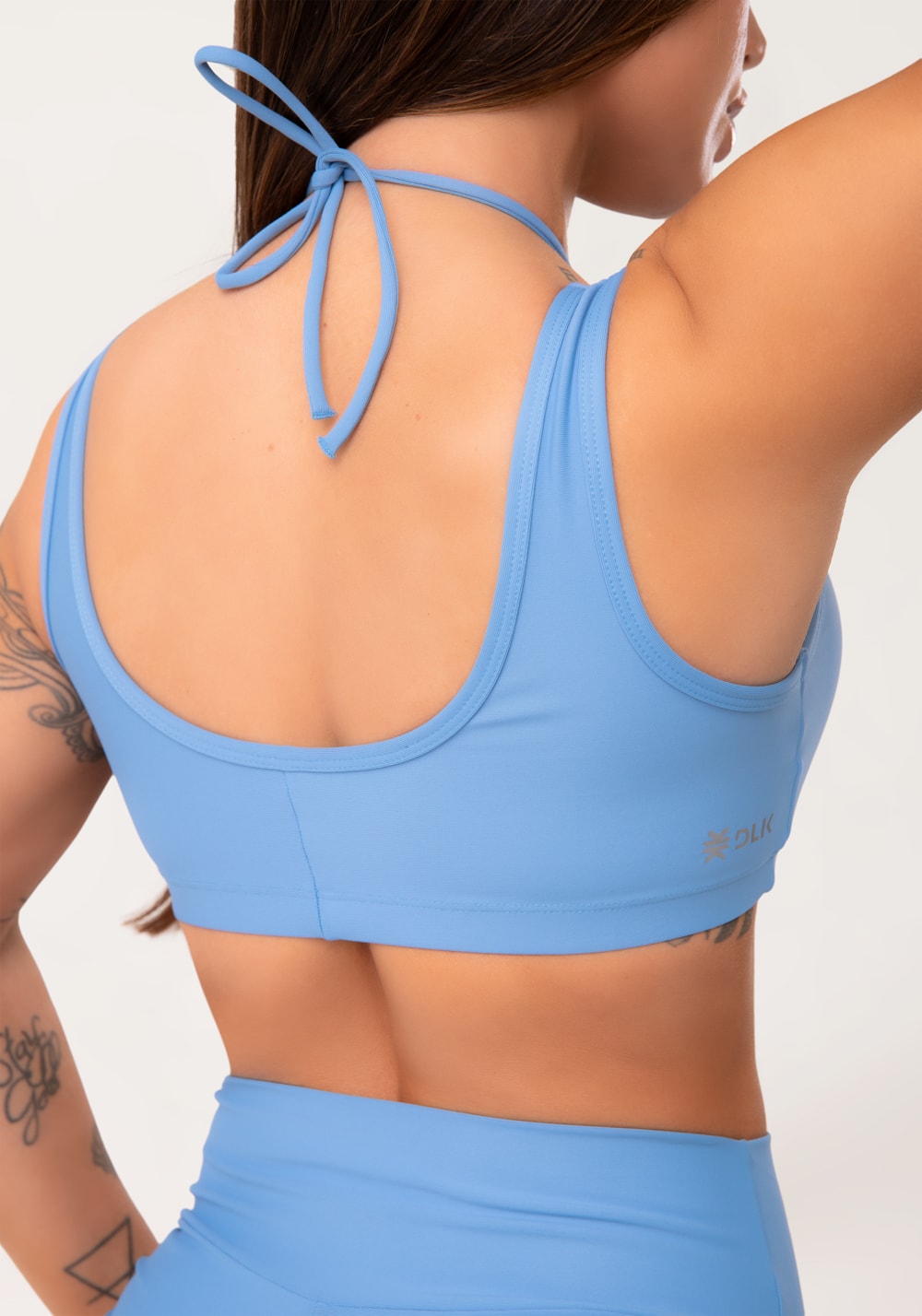 Top fitness feminino azul com franzido e amarração aura